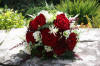 Red rose and ivory freesia handtied bride's bouquet